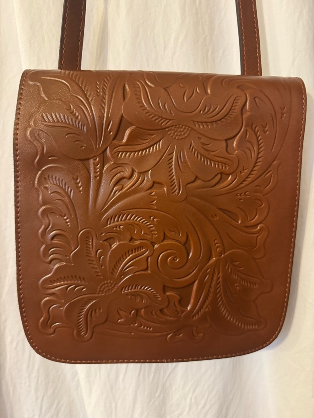 Patricia Nash Granada Tooled Leather Crossbody Bag in Brown . Adjustable strap.